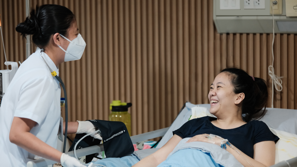 Nurse providing compassionate care to a chemotherapy patient at Tarlac Medical Center’s Chemo Infusion Unit.
