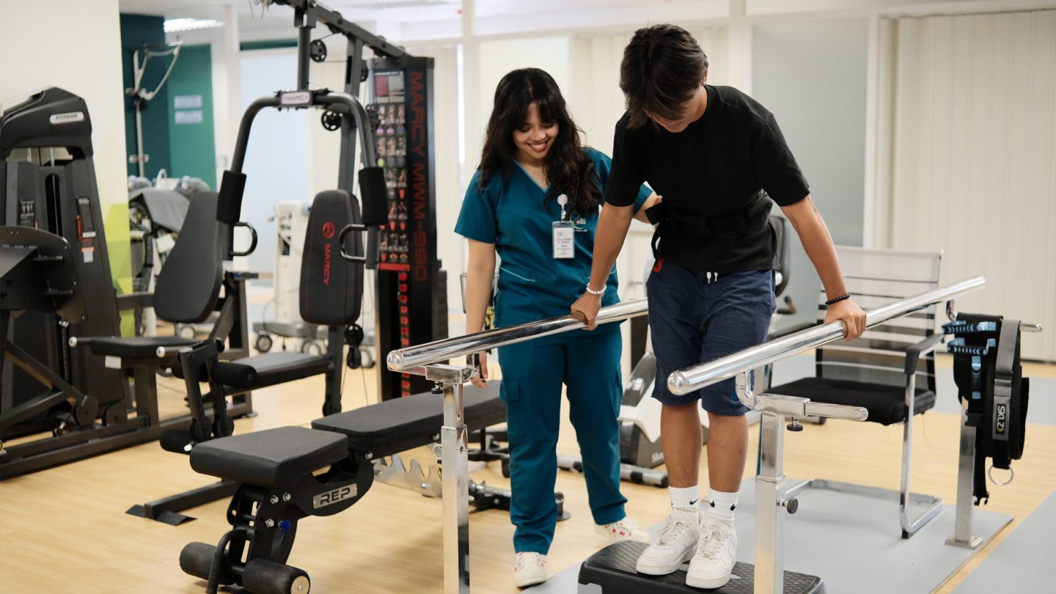 A Physical Therapist Treating A Patient At Tarlac Medical Center.