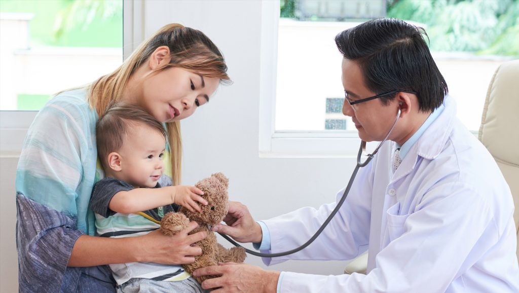 Developmental pediatrician conducting a child behavior assessment at Tarlac Medical Center.